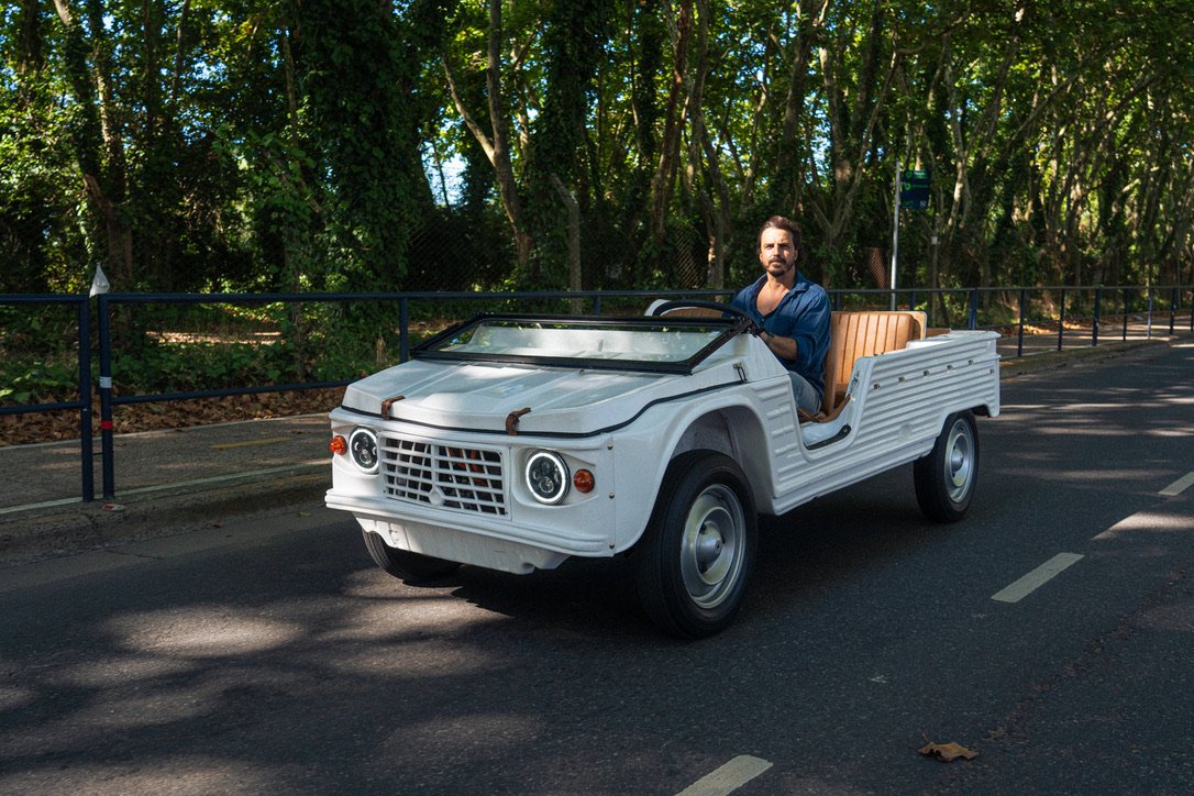 VIMS founder driving a white Méhari down a tree-lined French boulevard at golden hour
